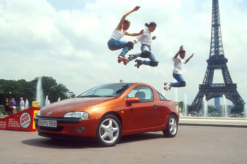 The most ‘90s press photo ever taken, presenting the 1994 Opel Tigra. Photo Credit: GM